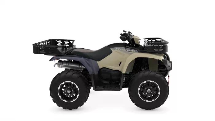 Yamaha Kodiak ATV with beige body, black seat, and front and rear cargo racks.