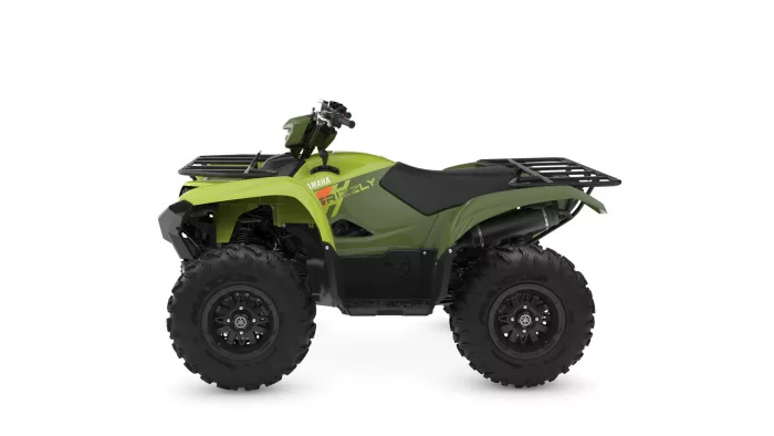Green all-terrain vehicle (ATV) with front and rear racks and large knobby tires, showing Yamaha branding on the side.