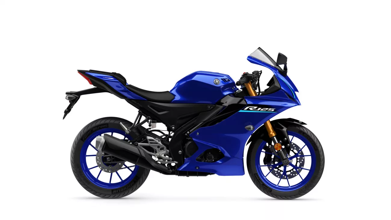 Blue Yamaha R125 sport motorcycle seen from the left side, showing its fairing, fuel tank, and front wheel with disc brake (side profile).