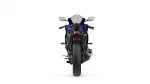 Rear view of a blue sport motorcycle showing taillight, mirrors, and exhaust against a white background.