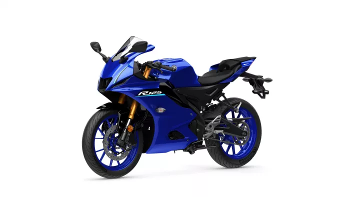 Blue sport motorcycle shown in a three-quarter front view with gold inverted forks and a clear windshield.