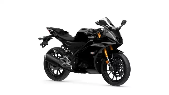 Black Yamaha R125 sport motorcycle viewed from a front-right angle, glossy black body with gold front forks.