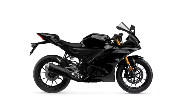 Side view of a black Yamaha R125 sport motorcycle with gold front forks and low-profile fairings