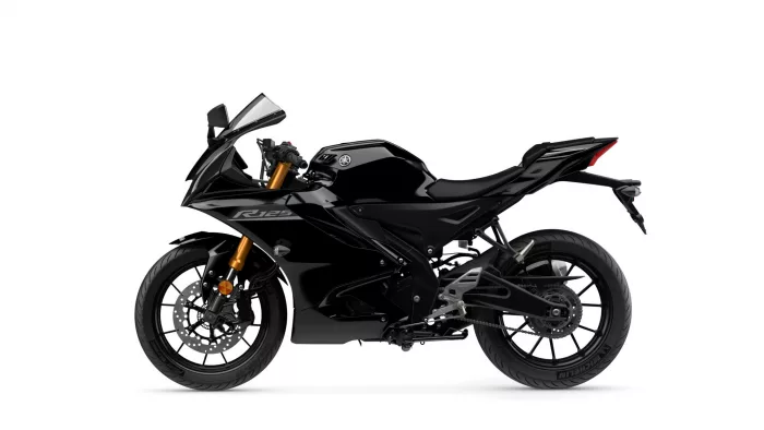 Black Yamaha R125 sport motorcycle shown in side profile with gold front forks and exposed disc brakes at the front wheel.