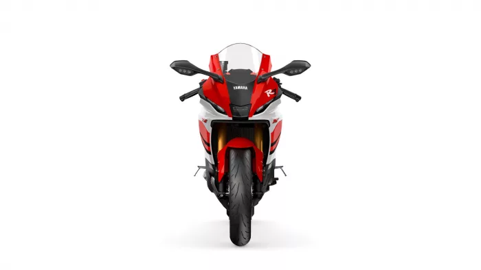 Front view of a red and white Yamaha R1 sport motorcycle facing the camera, with windshield and handlebars visible from the rider’s perspective
