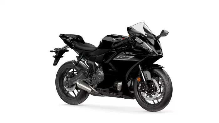 Black Yamaha sport motorcycle shown from a front-right angle with visible R1 logo on the fairing and large front brake discs.