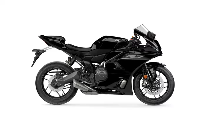 Black Yamaha YZF-R1 sport motorcycle shown from the left side with full fairings, windshield, and visible disc brakes.