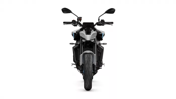 Front view of a modern sport motorcycle facing the camera, gray bodywork with black highlights and wide front tire.
