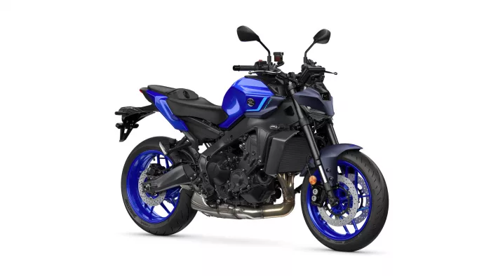 Blue sport motorcycle photographed from a front-right angle, showing blue bodywork, black frame, and alloy wheels with disc brakes