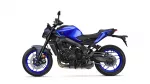 Blue sport motorcycle in side view, showing its blue fuel tank, black frame, and blue rims with disc brakes on the front wheel.