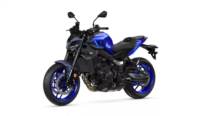 Blue sport motorcycle shown in a left-front three-quarter view with blue rims and black frame, isolated on white background.