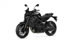Black sport motorcycle shown from a left-front three-quarter angle, highlighting its angular bodywork and disc brakes