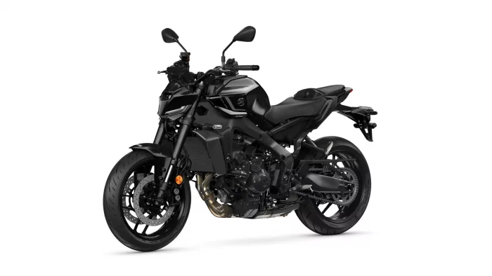 Black sport motorcycle shown from a left-front three-quarter angle, highlighting its angular bodywork and disc brakes