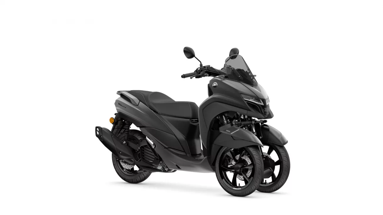 Front-right view of a dark gray Yamaha scooter with a tall windscreen and mirrors