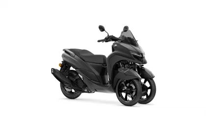 Front-right view of a dark gray Yamaha scooter with a tall windscreen and mirrors