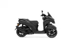 Split view of a black Yamaha scooter on a white background: rear section on the left and the front with handlebars on the right.