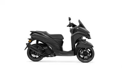 Split view of a black Yamaha scooter on a white background: rear section on the left and the front with handlebars on the right.