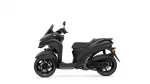 Side view of a black Yamaha scooter showing the front fairing, windshield, and long seat.
