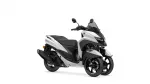 White and black Yamaha Tricity scooter shown in a three-quarter front view with windshield and mirrors.