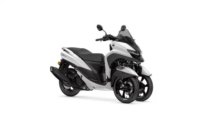 White and black Yamaha Tricity scooter shown in a three-quarter front view with windshield and mirrors.