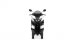 Front view of a white and black sport motorcycle with a rounded windscreen and side mirrors on a white background, head-on.