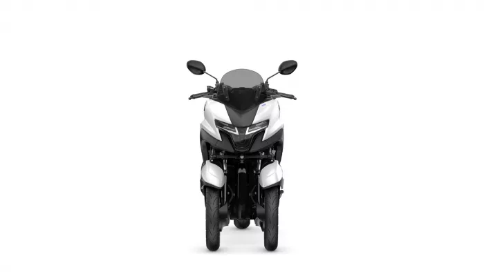 Front view of a white and black sport motorcycle with a rounded windscreen and side mirrors on a white background, head-on.
