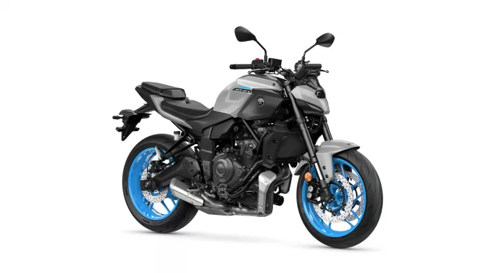 Yamaha MT-07 motorcycle with silver body and bright blue wheels, shown from a front-right side view.