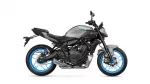 Side view of a grey Yamaha MT-07 sport motorcycle with bright blue wheels and exposed engine components