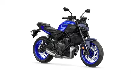 Blue Yamaha MT-07 sport motorcycle shown from a left-side angle with blue rims and exposed engine parts.