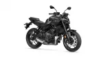 Black Yamaha MT-07 motorcycle shown from a front-right angle with exposed engine and dual disc brakes, matte black finish.