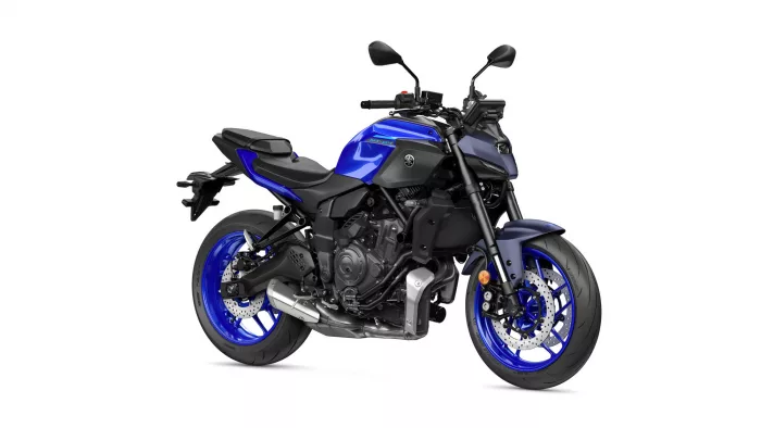 Blue Yamaha MT-07 sport motorcycle shown from a left-rear side angle with exposed engine and blue rims