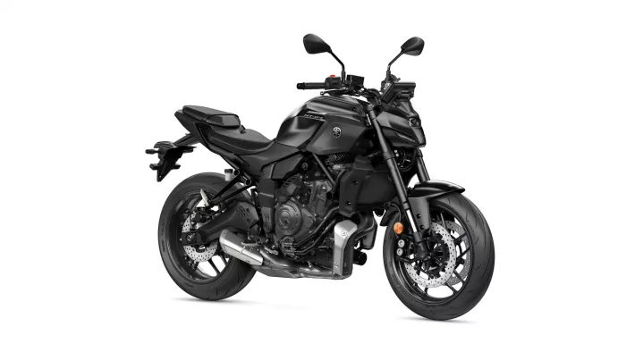 Black Yamaha MT-07 sport motorcycle shown in three-quarter front view on a white background, emphasizing its aggressive styling and exposed engine.