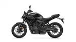 Black Yamaha MT-07 motorcycle shown in profile from the left side against a white background, highlighting its matte black finish and exposed engine.