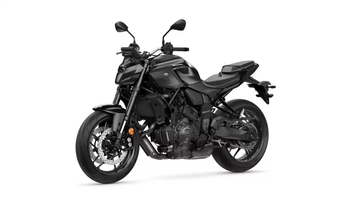 Black Yamaha MT-07 sport motorcycle photographed from a left-front side view against a white background, showing its bulk and details like the dual disc brakes and exposed engine parts