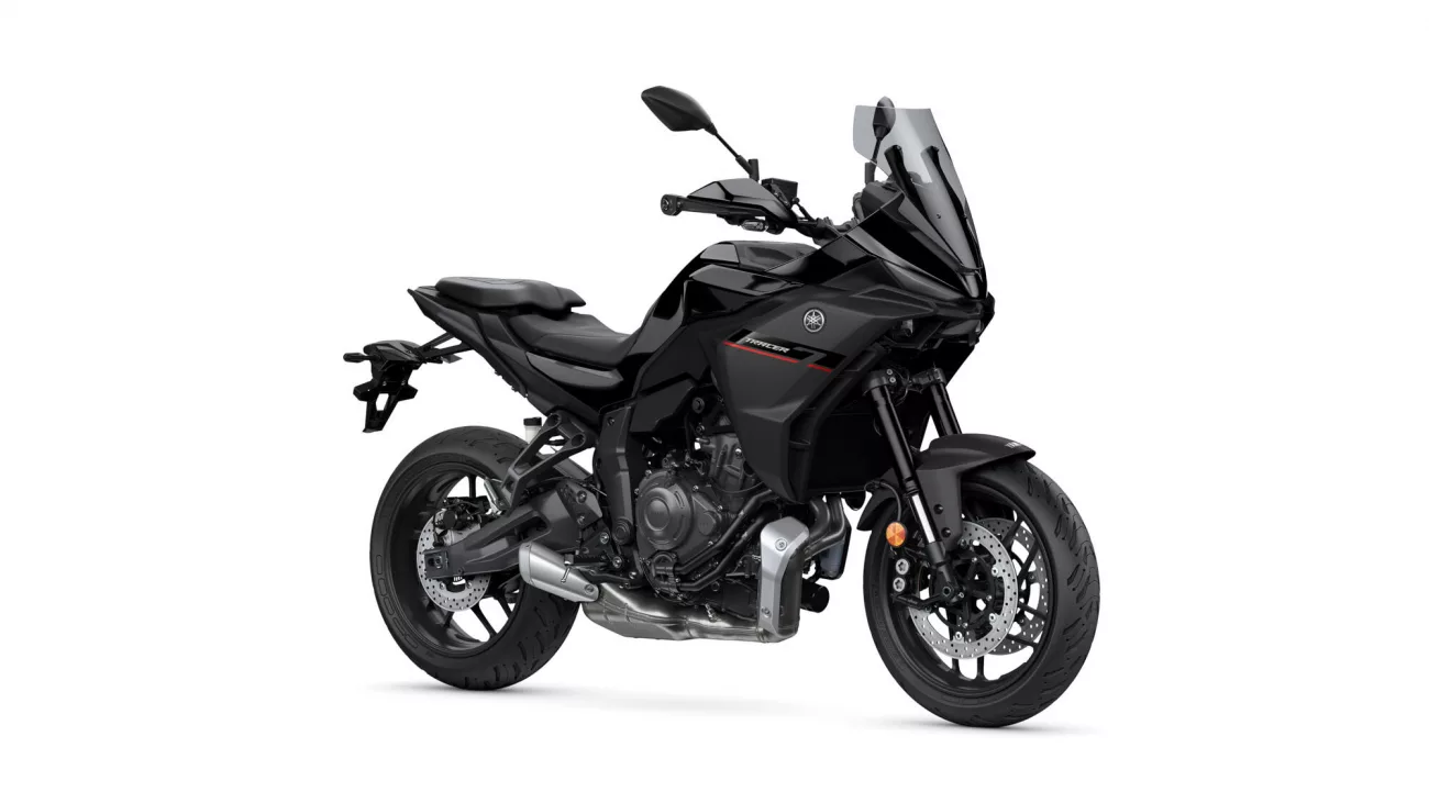 Black Yamaha Tracer sport-touring motorcycle with a tall windshield, shown from a front-left angle
