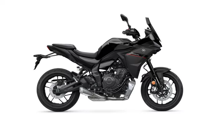 Black sport-tourer motorcycle shown in side profile, featuring a tall windshield and bold angular body panels.