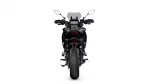 Rear view of a black motorcycle showing the wide rear tire, taillights, and handlebars against a white background, centered.