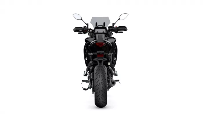 Rear view of a black motorcycle showing the wide rear tire, taillights, and handlebars against a white background, centered.