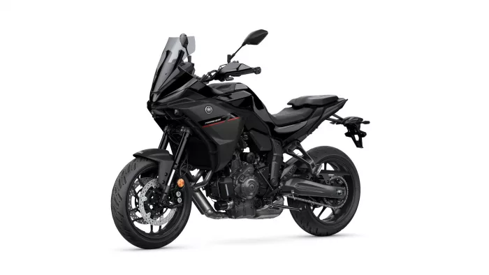 Black Yamaha Tracer sport motorcycle shown from a left-front side angle with a tall windscreen and red accent stripe on the fairing