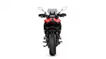 Rear view of a red sport motorcycle with black trim, showcasing the tail section, seat, and rear tire on a white background.