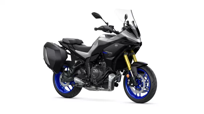 Black Yamaha Tracer 7 sport-touring motorcycle with hard side panniers and blue rims, angled front-right view