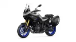 Yamaha Tracer 7 GT sport-touring motorcycle with black body, blue wheels, and side panniers facing left-front view