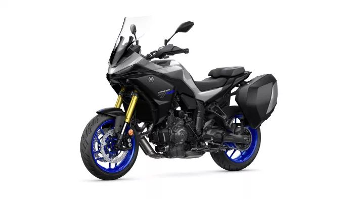 Yamaha Tracer 7 GT sport-touring motorcycle with black body, blue wheels, and side panniers facing left-front view