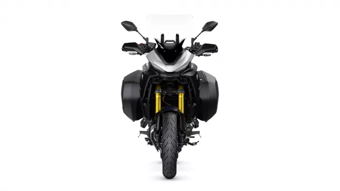 Front-on view of a black sport-touring motorcycle with white fairing and side panniers, facing the camera.