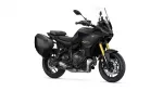 Black Yamaha Tracer GT sport-t touring motorcycle with attached side panniers and a clear windscreen, shown in a right-front angle.