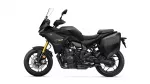 Side view of a black Yamaha Tracer 7 GT sport-touring motorcycle with front windshield and integrated hard panniers.