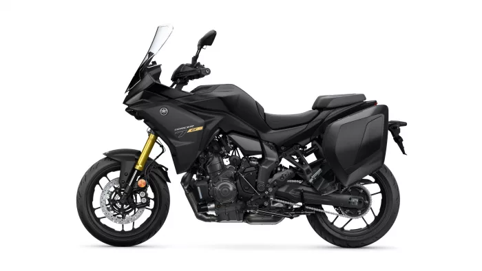 Side view of a black Yamaha Tracer 7 GT sport-touring motorcycle with front windshield and integrated hard panniers.