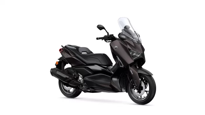 Dark brown Yamaha sport scooter viewed from front-left with a large clear windshield.