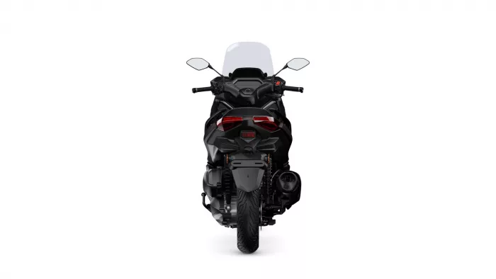 Rear view of a black sport motorcycle with a tall windshield, prominent taillights, and visible rear tire.
