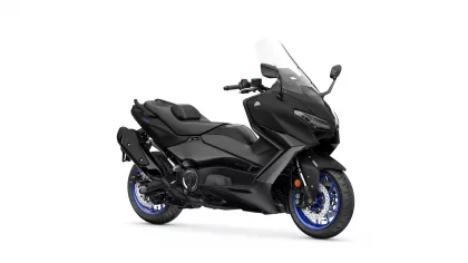 Black Yamaha sport motorcycle shown from the front-right side with a tall clear windshield and blue-accent wheels to emphasize its aggressive styling.